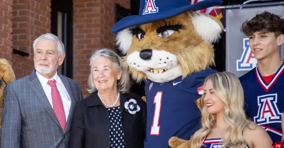 Bruce and Patricia Bartlett with Cheerleaders and Mascots