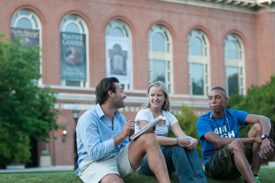 3 University students sitting outside the Arizona State Museum